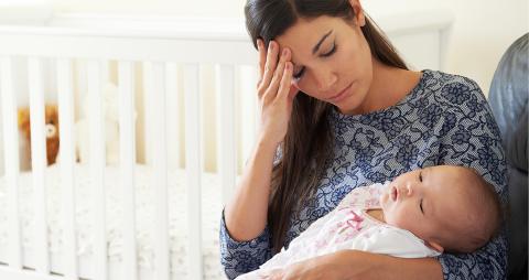 Tired Mother suffering from postpartum depression